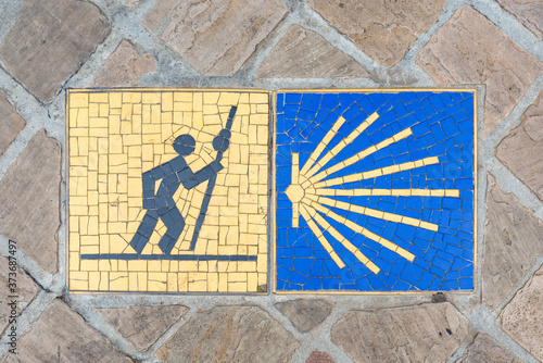 Camino de Santiago pilgrimage sign on the pavement in Chartres, France. photo