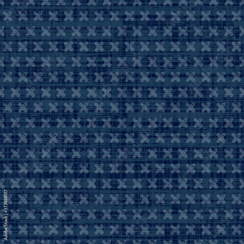 Ethnic seamless pattern. Indigo Grunge Background with Doodle crosses or letter X. Tribal geometric Ornamental pattern. Ethnic texture. Abstract Traditional decorative ornament 
