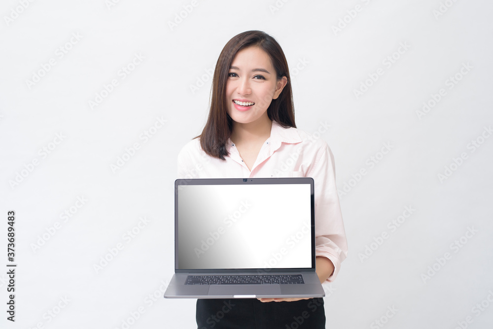 An asian woman is holding laptop computer on white Studio background An asian woman is holding laptop computer on white Studio background
