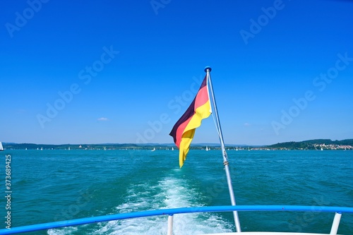 National German flag on the back of a ferry ship. on lake Bodensee Germany.
