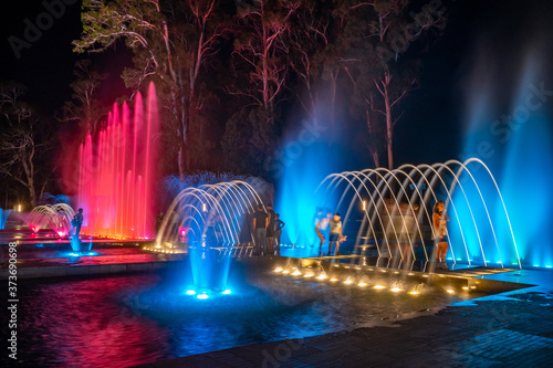 Colored musical water fountain at night. Shekvetili photo