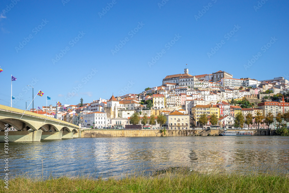 Coimbra cityscape with Santa Clara Bridge over Mondego river,  Portugal