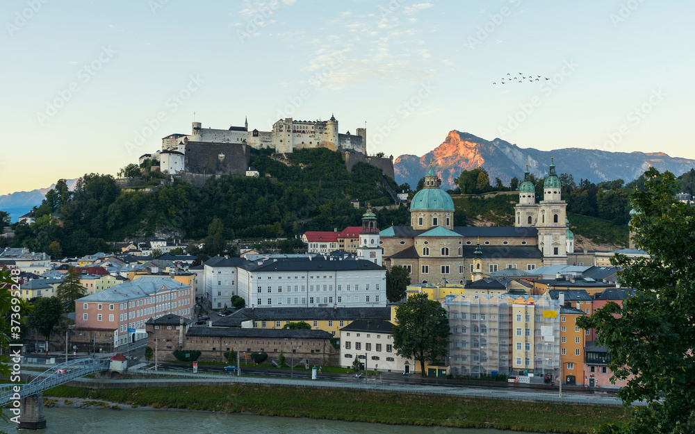 Salzburg Austria Morning cityscape. Included all attractions in the city. This amazing place is Wolfgang Amadeus Mozart's hometown. Central alps mountains on the background