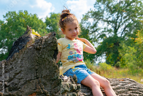 Little girl having fun on t...