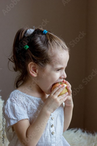 Funny little girl kid eats ...