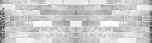 White grey gray light brick tiles wall texture wide background banner panorama 