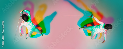 Collage of 1 teen girl in fencing costume with sword in hand on gradient background in neon light. Top view. Young model practicing  training in motion  action. Copyspace. Sport  youth  healthy