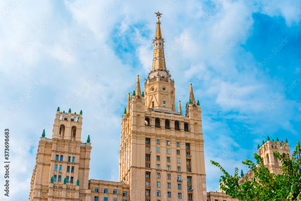 Old high-rise building in the center of Moscow, panorama of the city street in summer Old high-rise building in the center of Moscow, panorama of the city street in summer