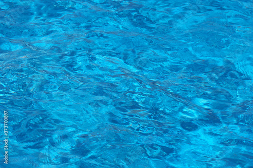 surface of blue swimming pool,background of water