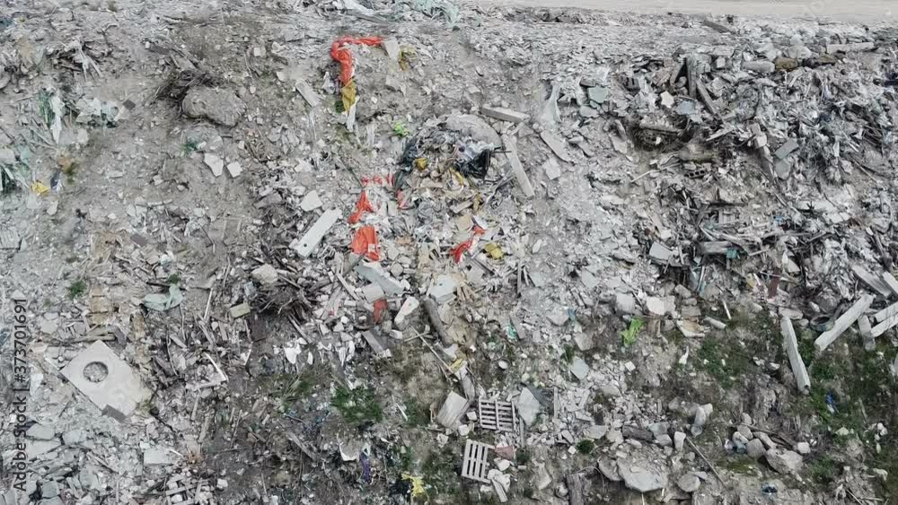 Dusty debris on city landfill, aerial shot of trash site full of garbage rubbish Dusty debris on city landfill, aerial shot of trash site full of garbage rubbish