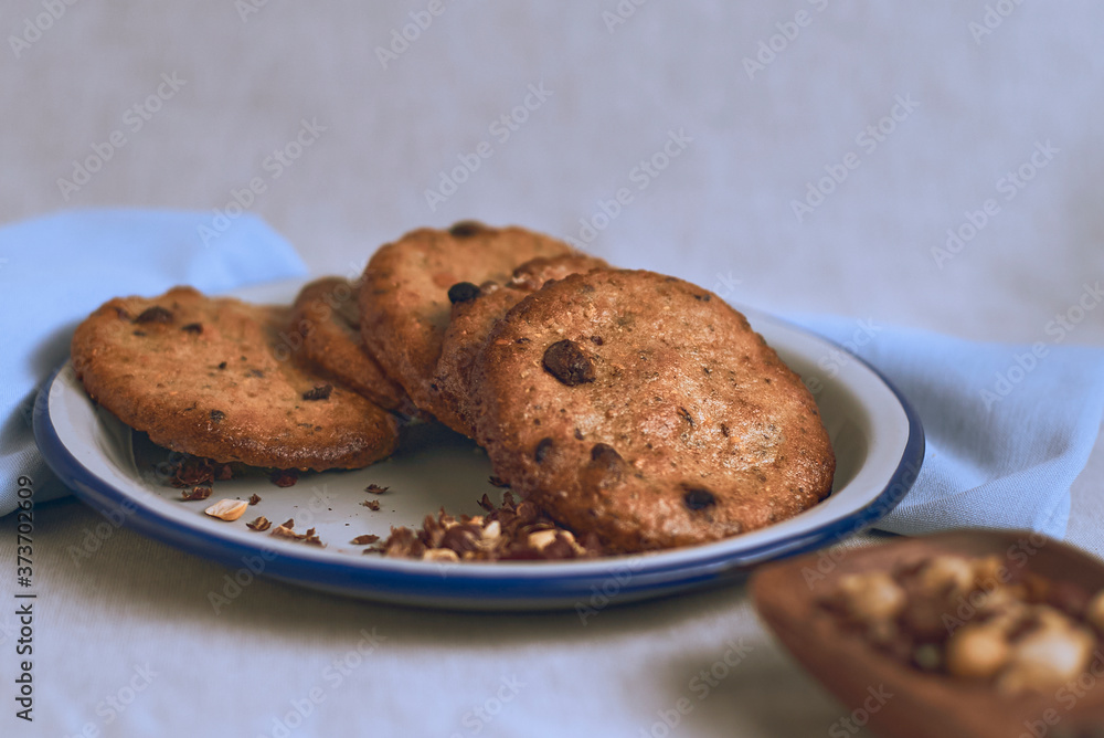 Chocolate chip cookies on a plate on a white background Chocolate chip cookies on a plate on a white background