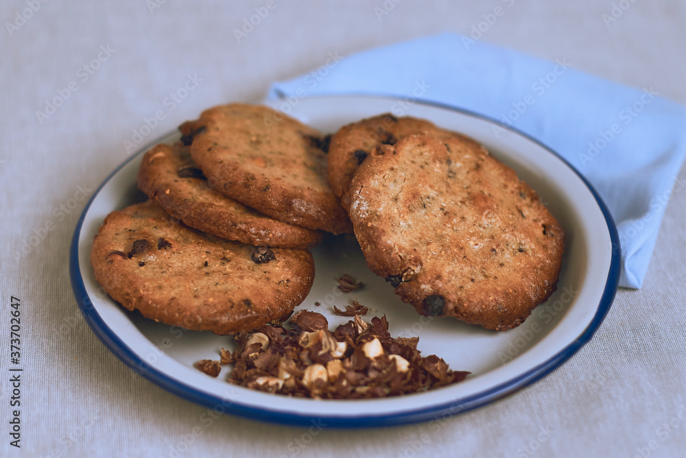 Chocolate chip cookies on a plate on a white background Chocolate chip cookies on a plate on a white background
