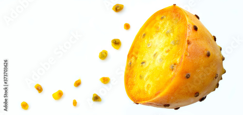 Prickly pear fruit in half across isolated on white background. Fresh sliced prickly pear and a lot of seeds with copy space. Sabra fruit. neon fruits - nopales cactus photo