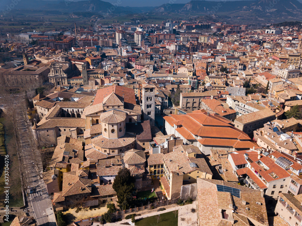 Views of houses and nature of ancient city Vic in Catalonia from high..
