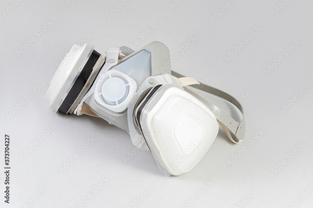 half mask respirator against white half mask respirator against white