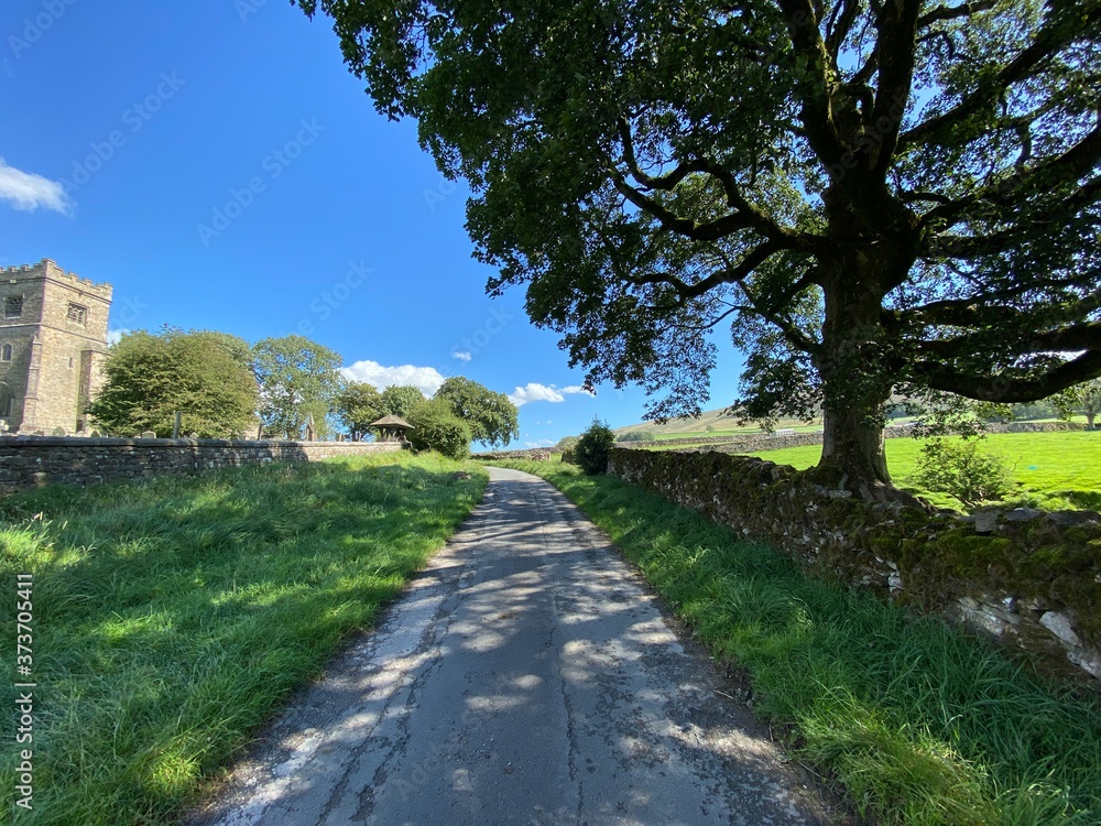 Country lane, leading up to the old church in, Rylstone, Skipton, UK