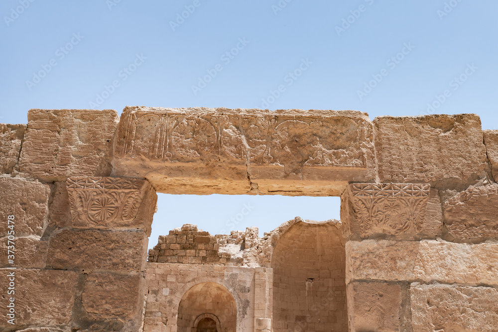 Decorative  stone carvings on walls in ruins of Shivta - a national park in southern Israel, includes the ruins of an ancient Nabatean city in the northern Negev.