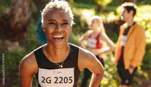 Obraz na plátne Cheerful cross country marathon runner
