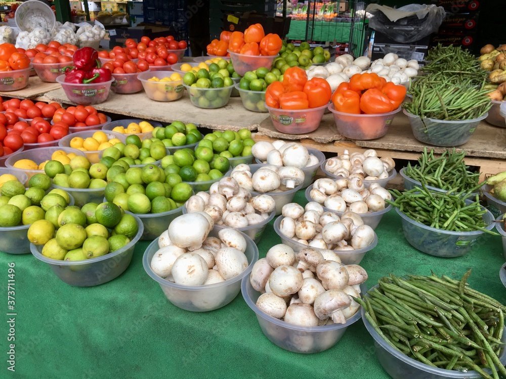 Mushrooms and limes on display at a farmers market - UK