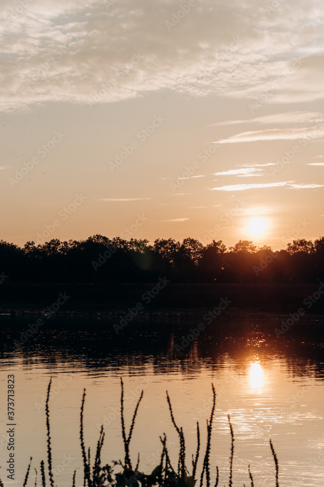 Sunset on the lake. Beautiful sunset on the lake. Sunset on the lake. Beautiful sunset on the lake.