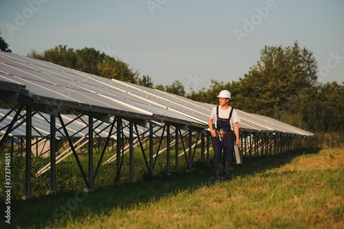 Renewable energy and solar power concept, worker or Electrical engineers are checking and training installing photovoltaic plant in solar power station alternative energy from nature