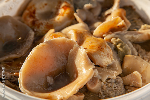 Altai salted mushrooms gruzd - milk mushroom in a plastic bucket at the fair