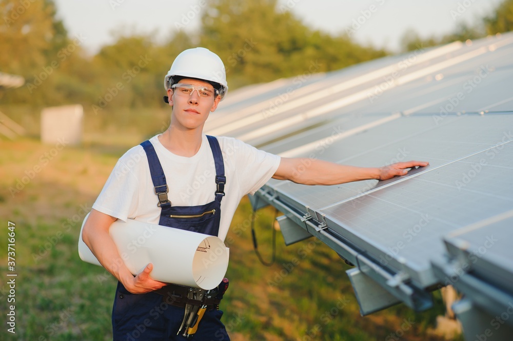 Obraz premium Young adult doing professional training on solar panels plant
