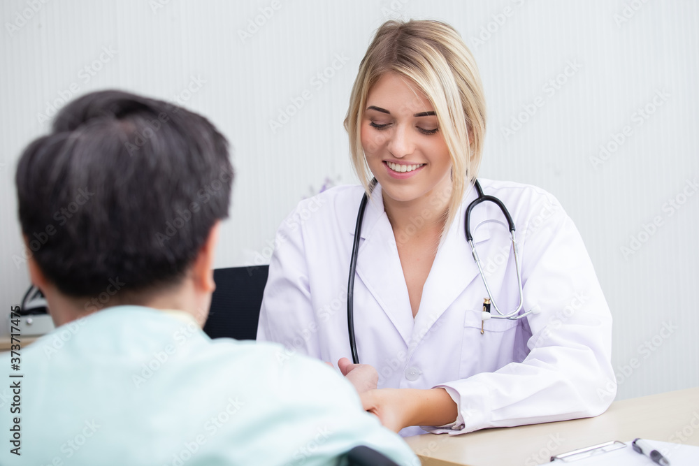 woman doctor examining pulse measurement of senior male patient sitting wheelchair undergoing treatment for heart disease. health care concept. woman doctor examining pulse measurement of senior male patient sitting wheelchair undergoing treatment for heart disease. health care concept.