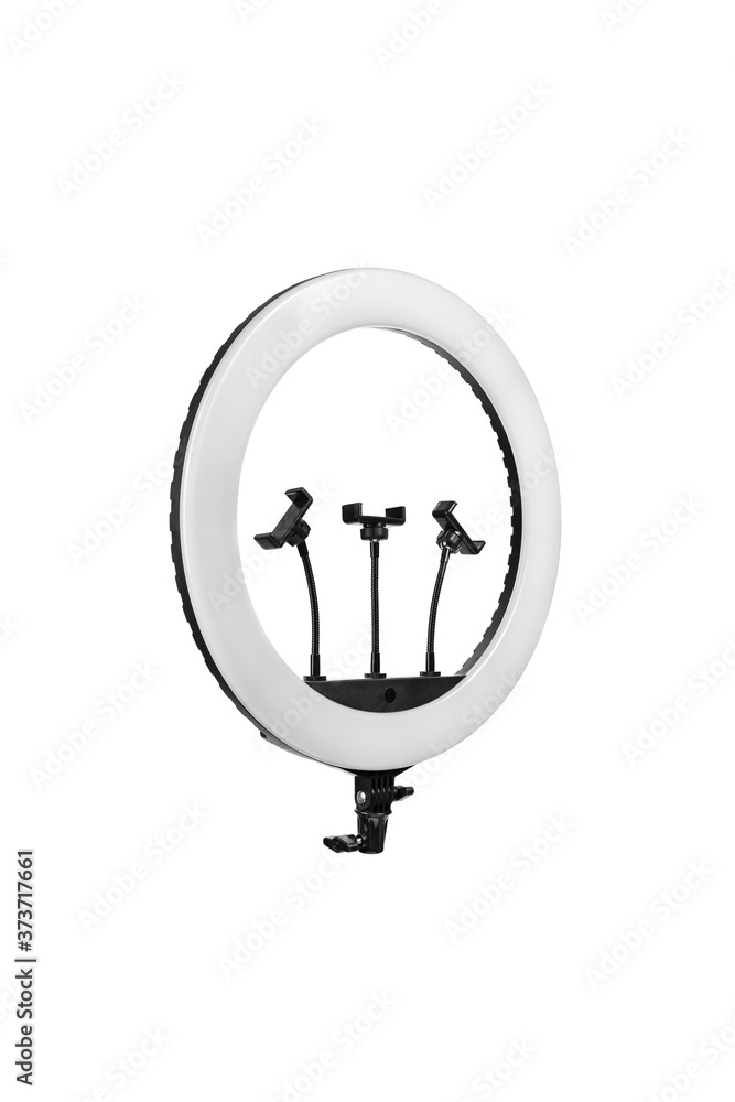 Closeup of circular neon LED lamp isolated white background. Popular modern light for make-up and beauty portraits. Closeup of circular neon LED lamp isolated white background. Popular modern light for make-up and beauty portraits.