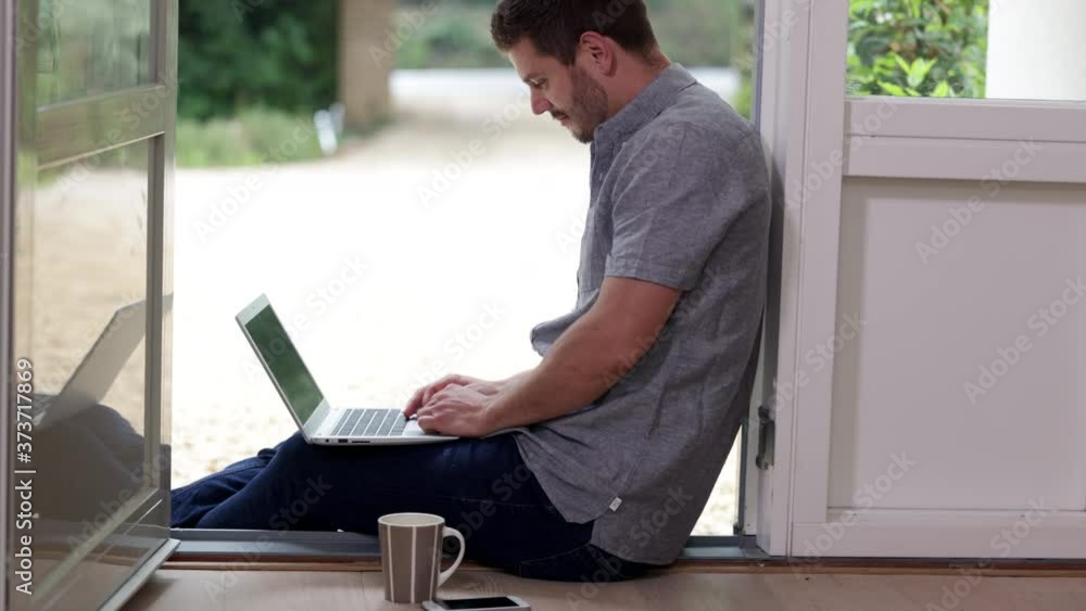 Businessman Working From Home On Laptop During Pandemic Lockdown Businessman Working From Home On Laptop During Pandemic Lockdown