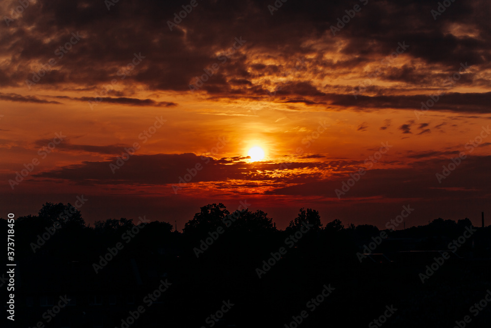 Beautiful sunset. Orange sunset. The moon at sunset Beautiful sunset. Orange sunset. The moon at sunset