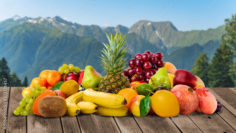 Fresh fruits. Tropical Fruits On The Table - obrazy, fototapety, plakaty 