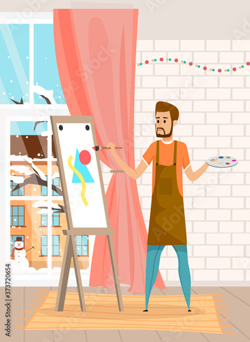 Serious bearded man drawing the picture holding paint brush standing near easel in home interior near window with winter cityscape view. Painter male character engaged favorite hobby in room or studio