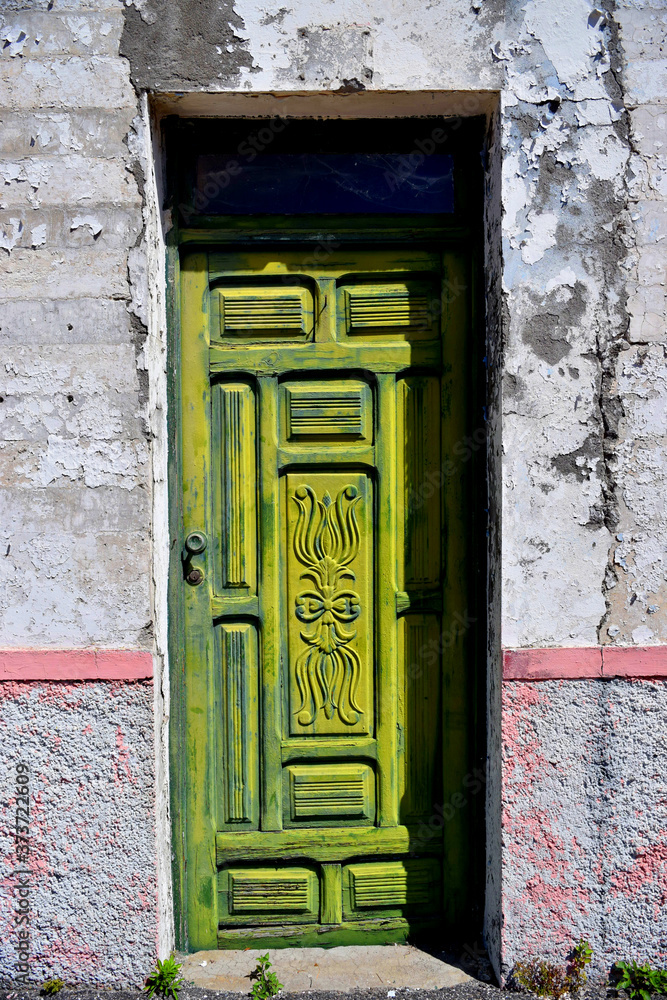 old wooden green door in old town