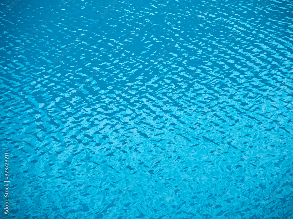 Rippled water texture. Natural background of blue sea or lake surface