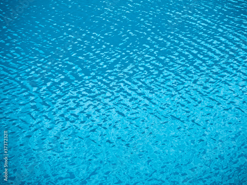 Rippled water texture. Natural background of blue sea or lake surface
