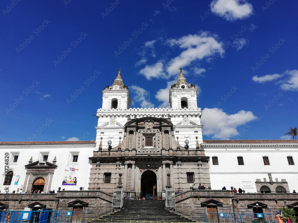 Old church seen from the front in sunny day. Iglesia de San Francisco in Quito, Ecuador, view of its main entrance