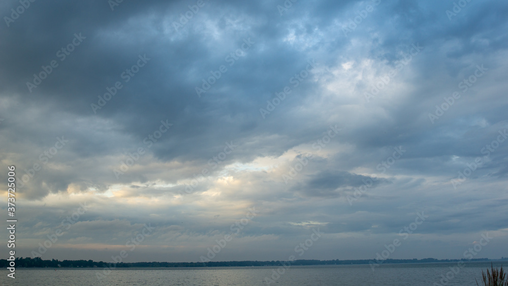 Dark navy clouds over lake
