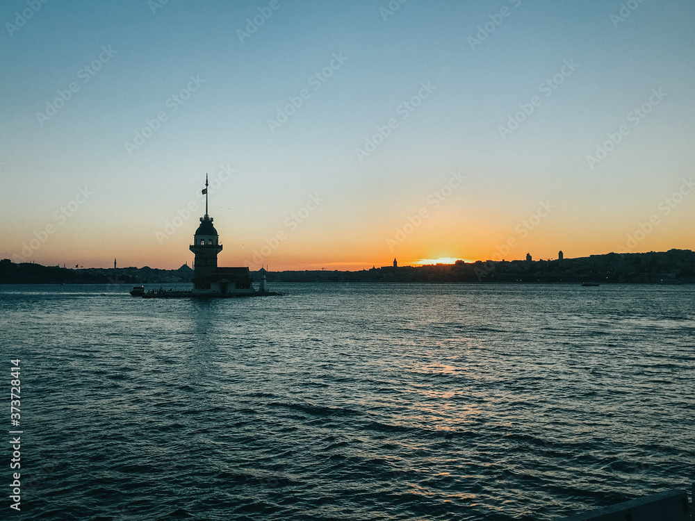 Istanbul Maiden Tower (Kiz Kulesi) at sunset on the entrance to Bosporus Strait in Istanbul, Turkey