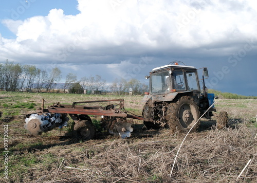 agricultural work, tractor plowing the land