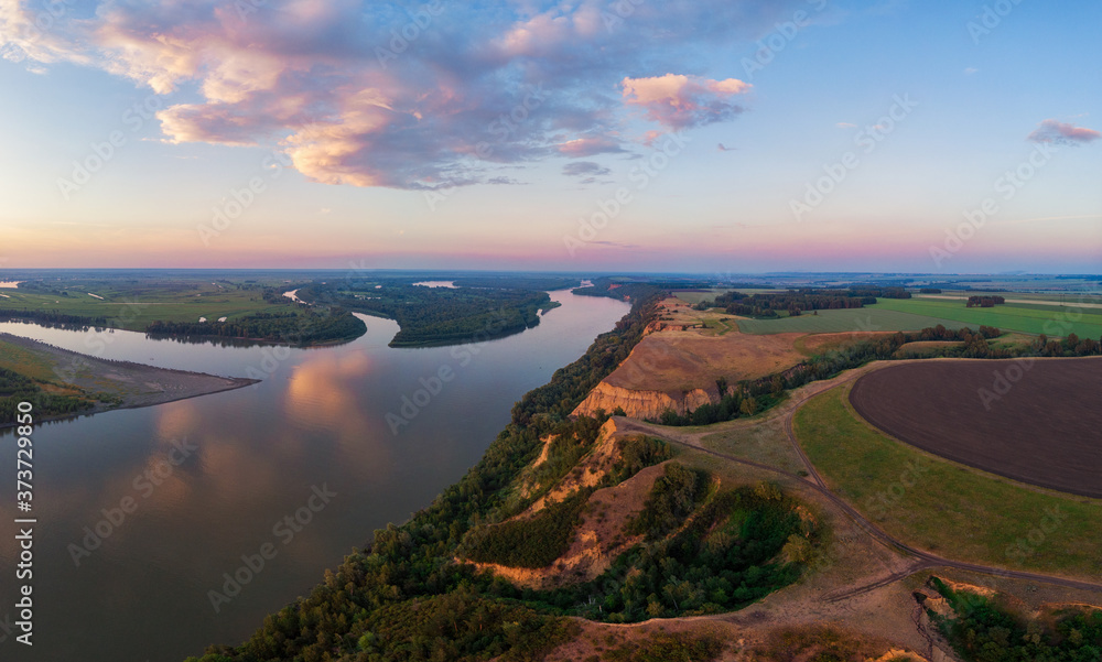 Aerial drone view of river landscape in sunny summer evening. Top view of siberian Ob river from high attitude in summer sunset. Panorama, bird's eye view - obrazy, fototapety, plakaty 