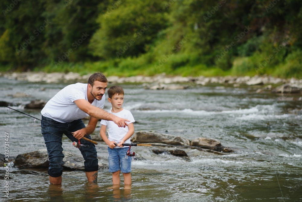Fototapeta premium Father and son together fishing