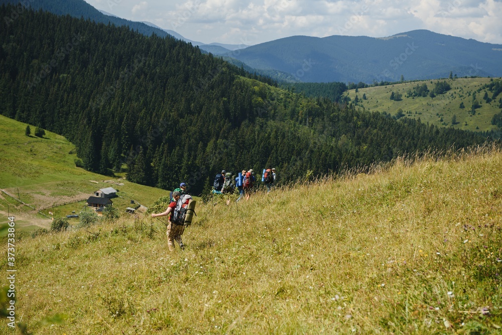 Group of hikers walking on mountain