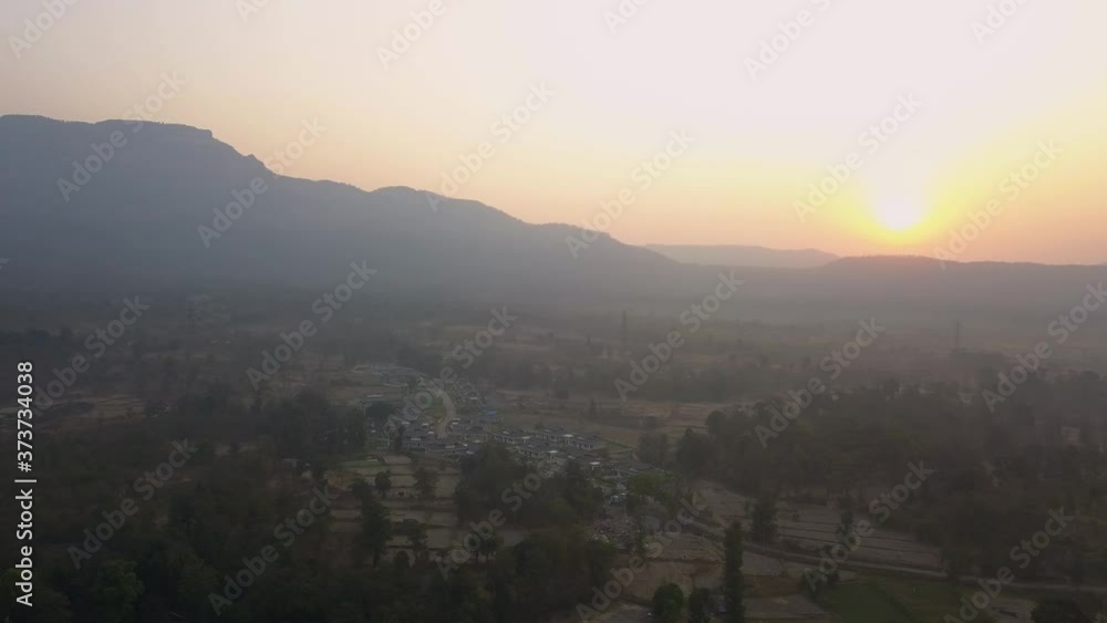 Stunning View Of Sunrise Shining Over The Mountain Landscape Near The Quiet Village In Mumbai, India. - Aerial Drone Stunning View Of Sunrise Shining Over The Mountain Landscape Near The Quiet Village In Mumbai, India. - Aerial Drone