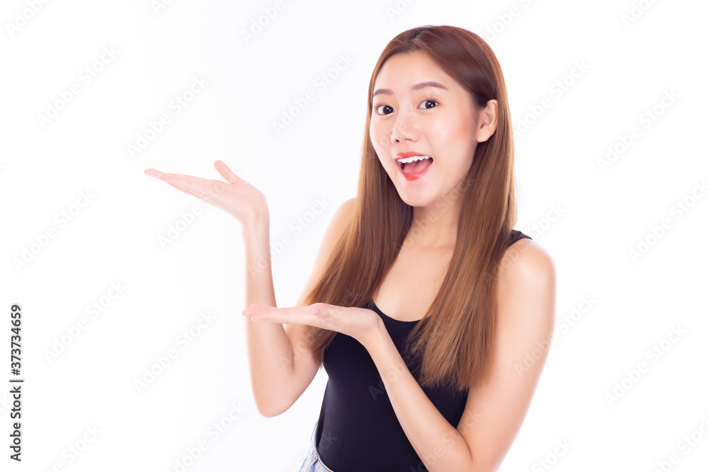 Happy beautiful young asian woman over isolated on white background holding copy space imaginary on beauty palm for insert advertisement, happiness and smiley face. Attractive beautiful girl portrait Happy beautiful young asian woman over isolated on white background holding copy space imaginary on beauty palm for insert advertisement, happiness and smiley face. Attractive beautiful girl portrait