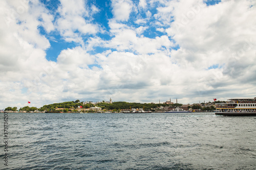 Panoramic shot of the old town Istanbul, Turkey. The Hagia Sophia Mosque, The Topkapi Palace, The Sepetciler Palace, Eminonu, ferries and boats on the Golden Horn.