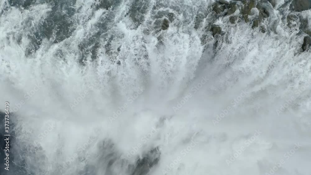 Drone top-down view of Dettifoss Waterfall, Iceland - close-up rotating shot Drone top-down view of Dettifoss Waterfall, Iceland - close-up rotating shot