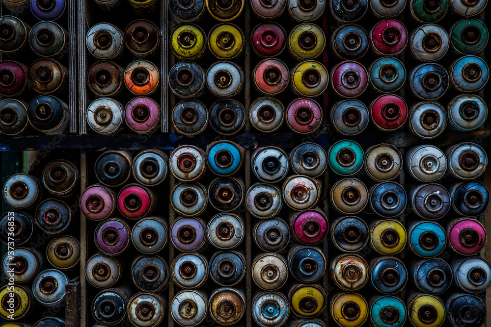 Colorful spray graffiti paint bottles stacked to be a background image, Karakoy, Istanbul, Turkey Colorful spray graffiti paint bottles stacked to be a background image, Karakoy, Istanbul, Turkey