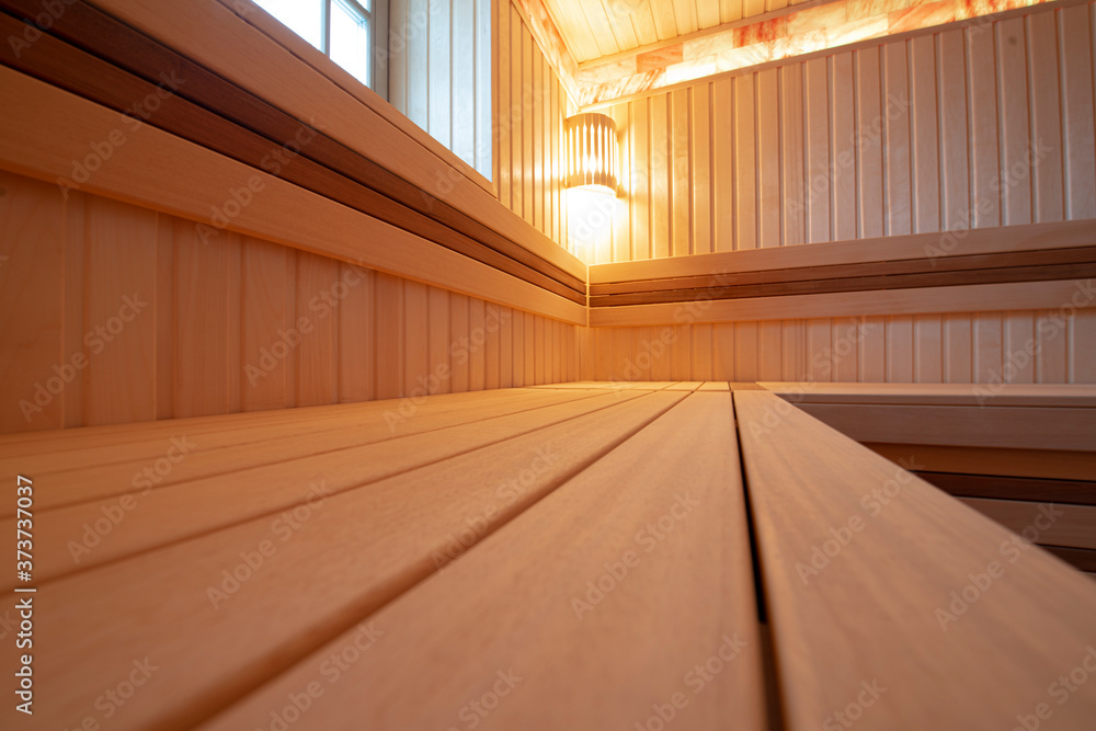 Fototapeta premium Wooden sauna with modern lighting