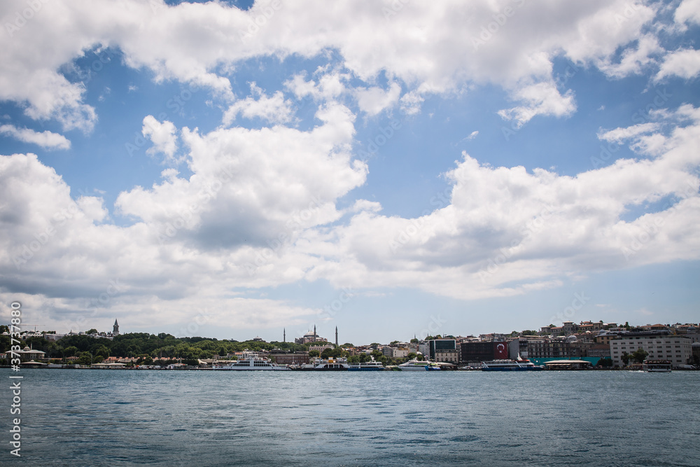 Panoramic shot of old town Istanbul, Turkey. The Hagia Sophia Mosque, The Topkapi Palace, Eminonu, ferries and boats on the Golden Horn.